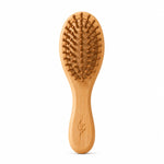 Bamboo kids hairbrush on a white background