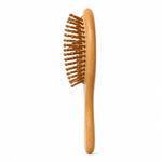 Bamboo kids hairbrush on a white background