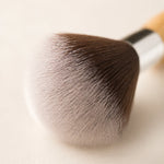 Close-up of a makeup brush with a soft focus background