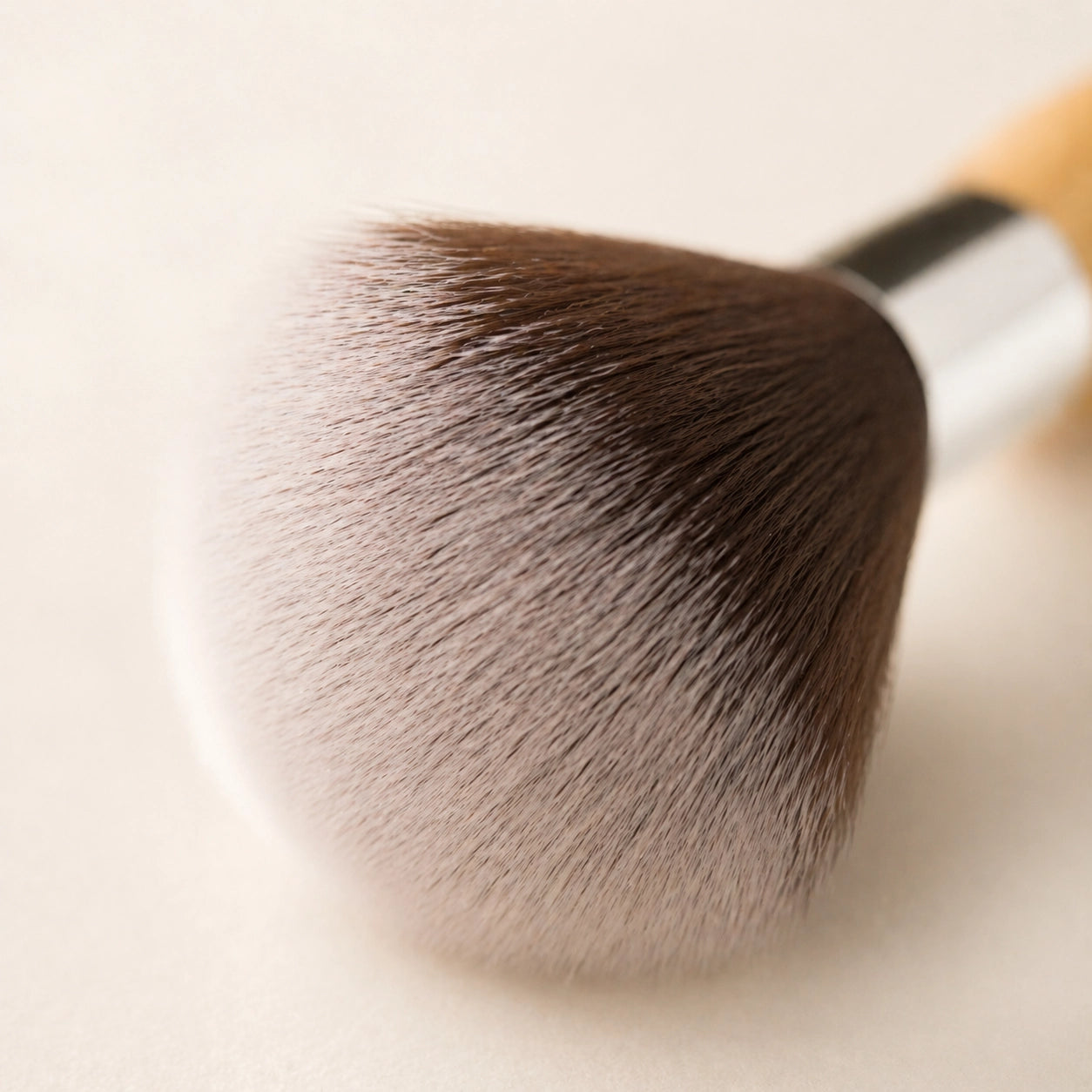 Close-up of a makeup brush with a soft focus background