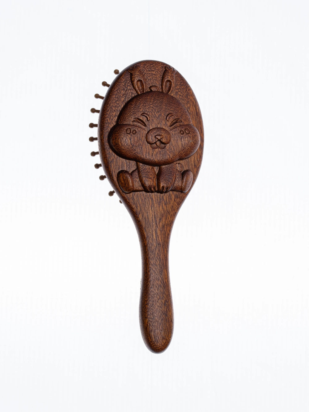 sandalwood kids hairbrush with a cartoon character design on a white background