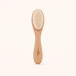 Bamboo newborn baby brush with natural bristles on a white background