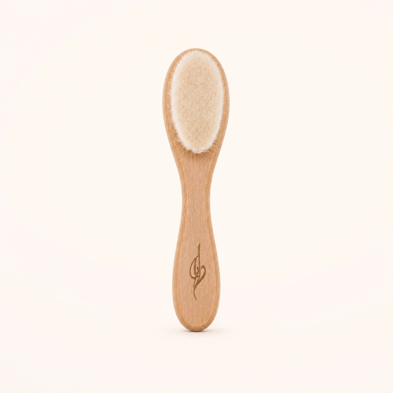 Bamboo newborn baby brush with natural bristles on a white background